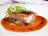 Sea Bass Fillet, Fennel Compote, and Bouillabaisse Reduction with Argan Oil